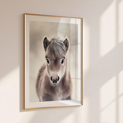 Adorable baby pony poster in soft neutral tones – perfect for nurseries, kids rooms or farm-themed interiors. Printed on 200 gsm semi-glossy FSC-certified paper. Available in DIN A4–A0 and standard sizes like 30×40 cm and 50×70 cm. Made to order and eco-friendly. Ideal gift for pony lovers and baby room decoration. Be proud. Be kind. Be wild – by Dezinbazar.