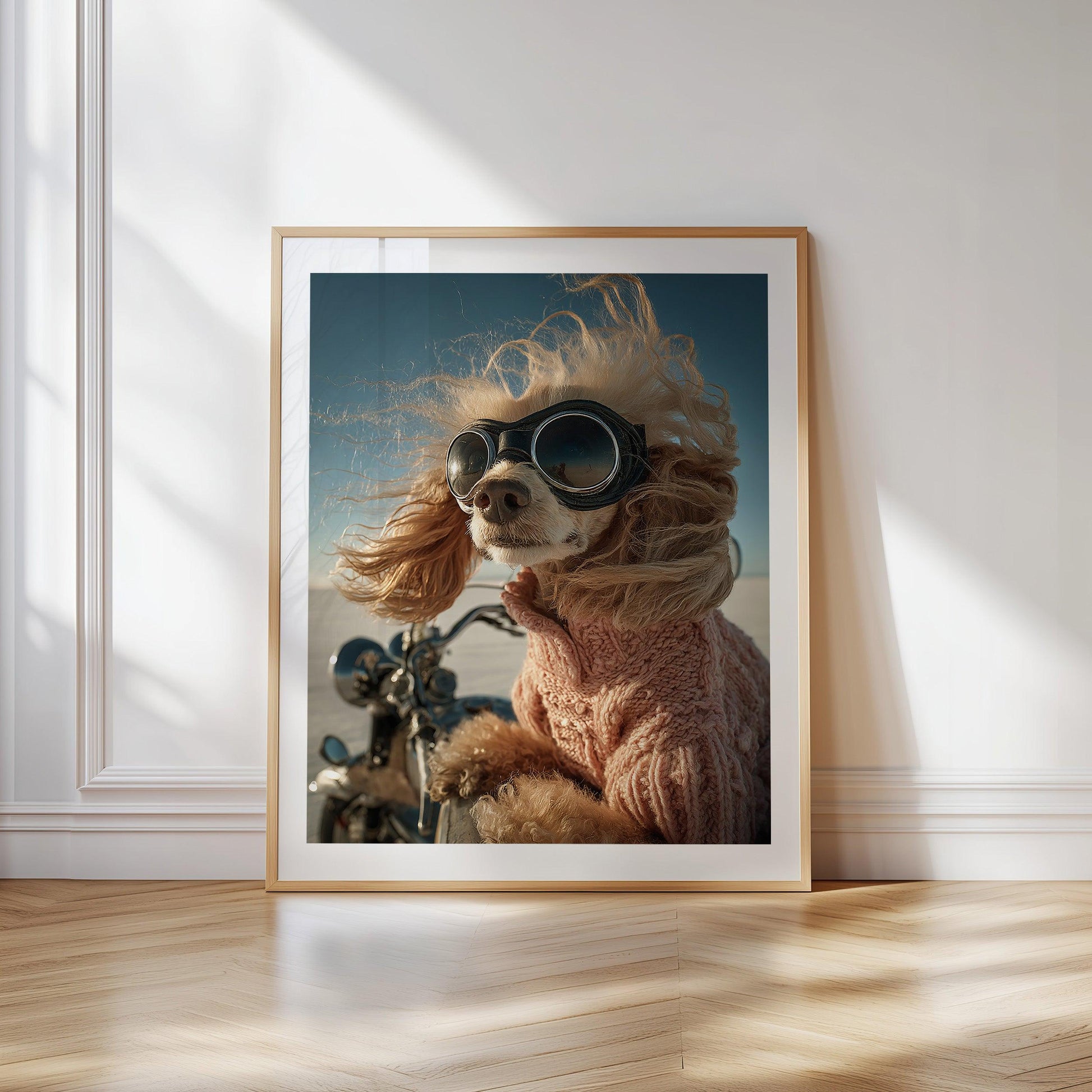 Humorous and bold printable wall art of an apricot poodle wearing aviator goggles and a pink sweater, riding a motorcycle across a bright salt flat. Wind in its curls, the dog looks proud and adventurous. Perfect for dog lovers who appreciate quirky,